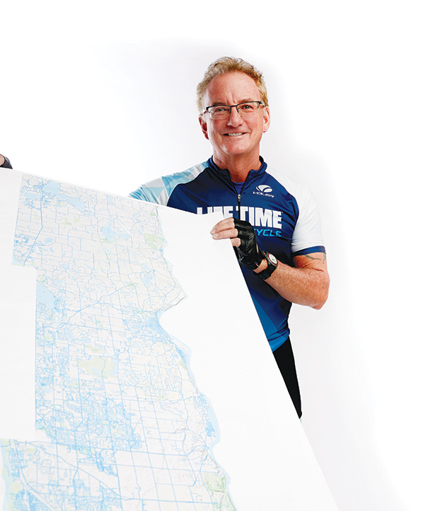 Terry Stille holds up a map of Washington County