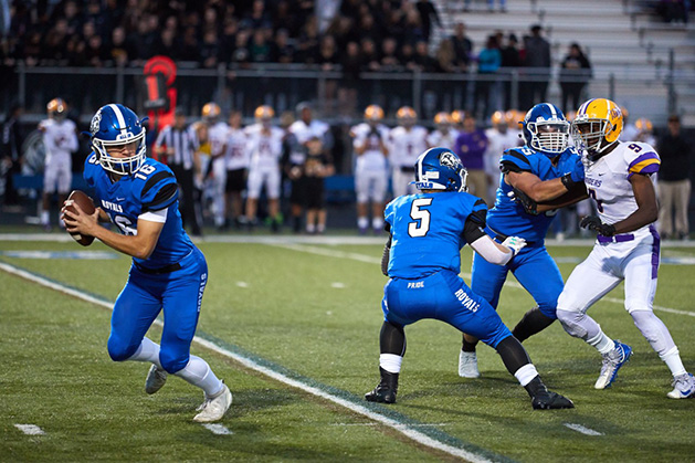 Woodbury High School football quarterback Charlie Wilson prepares to pass.